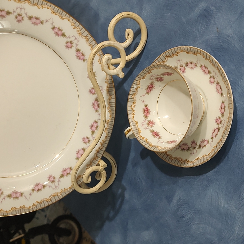 Matching cup and saucer with previous plates
